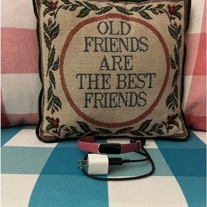 A practically new Fitbit. Pink strap and charger included.